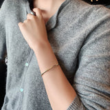 Pulsera femenina de temperamento dorado flameado