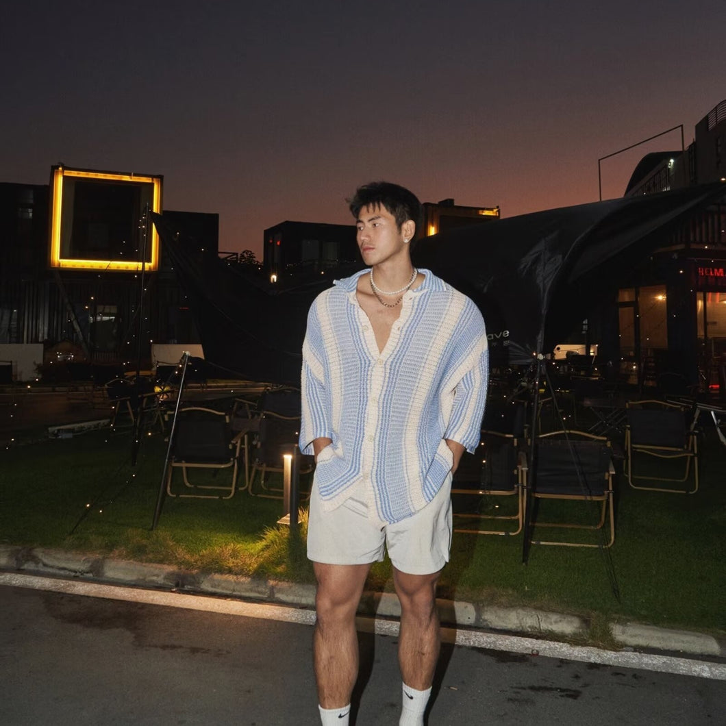 Top fino de punto informal con solapas sueltas de verano